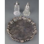 A silver plated salver with fancy rim, 2 plated mounted shakers