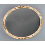A 1930's oval plate wall mirror contained in a white lacquered chinoiserie style frame 17" x 20 1/2"