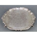 A George II silver salver with chased floral and scroll decoration on pad feet 10 1/2", maker Robert