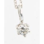 A 9ct white gold diamond pendant approx 0.2ct hung on an 18ct white gold chain