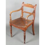 A Georgian mahogany bar back carver chair with plain mid rail and solid seat, raised on turned