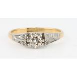 An 18ct yellow gold single stone illusion set diamond ring size J 1/2