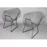 In the manner of Harry Bertoia, a pair of black painted diamond chairs