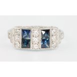 An 18ct white gold Art Deco style sapphire and diamond ring size O