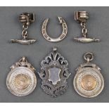 A pair of silver novelty cufflinks in the form of fish and fishing reels, 3 fobs and a horseshoe