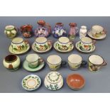 A collection of Torquay ware including tea cups and saucers, minor vases etc