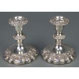 A pair of silver plated repousse candlesticks 6"