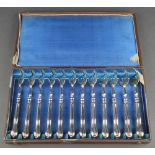 A set of 12 Dutch silver lobster forks in a fitted case