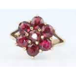 A 9ct yellow gold garnet cluster ring size K