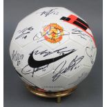 Manchester United, a signed football, signatures include Wayne Rooney