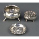 A Georgian silver salt on hoof feet, rubbed date letters, a Continental repousse bowl and ditto dish