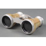 A pair of gilt metal and mother of pearl opera glasses complete with leather carrying case Slight