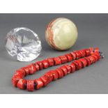 A large faceted glass paperweight 3", a turned onyx ball 3" and a hardstone necklace