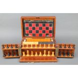 A 19th Century mahogany games compendium comprising a Staunton chess set, set of draughts, set of