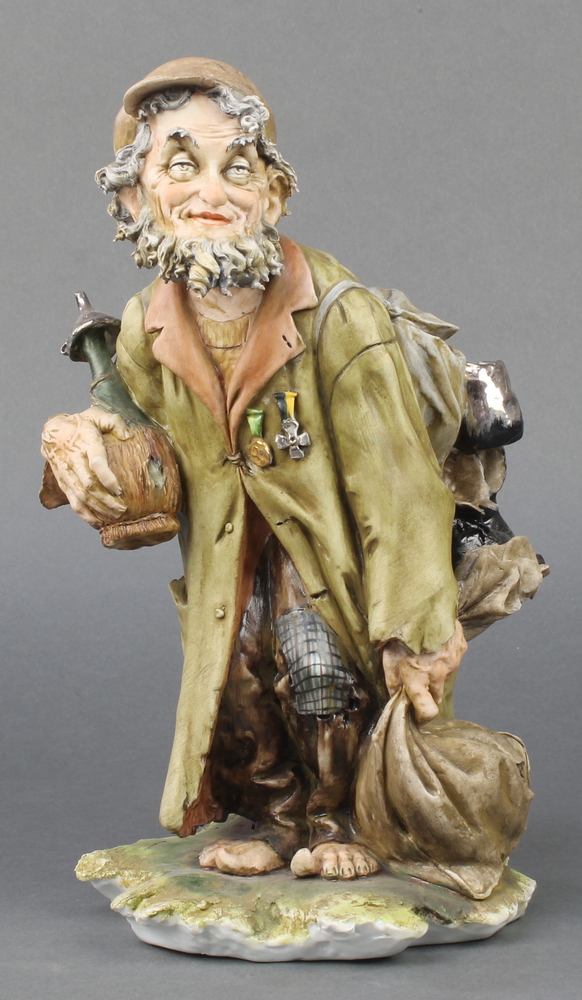 A Capodimonte figure of a tramp 11"