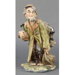 A Capodimonte figure of a tramp 11"