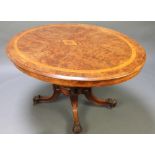 A Victorian oval figured walnut Loo table with crossbanded and inlaid top, raised on 4 turned