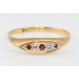 An 18ct yellow gold diamond and ruby ring size T