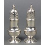 A pair of Georgian design silver shakers of plain form C J Vander London 1965 4 3/4", 190 grams