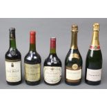 A 1976 bottle of Chateau Talbot St Julien, a 1990 Cellier des Dauphins Cotes du Rhone, a bottle of