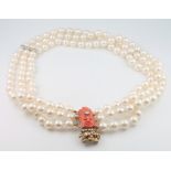 A 3 strand cultured pearl necklace with white gold and diamond set bars, the yellow gold clasp
