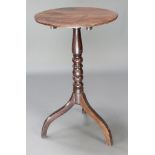 A 19th Century circular snap top wine table raised on a bobbin turned column and tripod supports