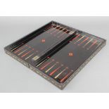 A black lacquered folding chess/backgammon board There are slight chips to the side