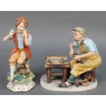A Capodimonte group of a cobbler signed Antonio with certificate 8 1/2", a ditto of a boy playing