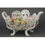 A late 19th Century German porcelain centrepiece 12" There are minor chips to the flowers