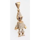 A 9ct yellow gold gem set articulated clown pendant