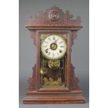 A 19th Century American shelf alarm clock with paper dial, alarm dial, contained in a pine case, the