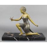 An Art Deco spelter and marble figure group of a kneeling girl with birds, the rectangular marble