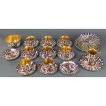 A matched Imari pattern tea set comprising 8 tea cups, 7 saucers, milk jugs, sugar bowl, 12 small