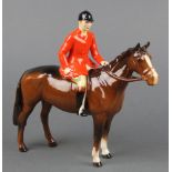 A Beswick figure - Huntsman on a brown horse model no. 1501 8 1/4"