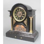 A French 8 day striking mantel clock contained in a large and impressive arched black marble case