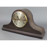 A 1930's chiming mantel clock with silvered dial and Roman numerals contained in an oak Admirals hat