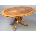 A Victorian figured walnut Loo table, the quarter veneered top with inlaid stringing raised on 4