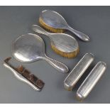 A silver engine turned 6 piece dressing table set comprising hand mirror, 2 hair brushes, 2