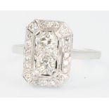 An 18ct white gold Art Deco style up finger diamond ring, approx. 0.80ct, size N 1/2