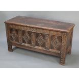 A 17th/18th Century coffer of panelled construction with hinged lid, fitted a candle box, 29 1/2"h x