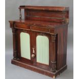 A William IV rosewood chiffonier with raised back fitted a shelf, the base fitted 2 drawers above