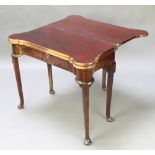 A Georgian mahogany triple top card table with tea table, the card table fitted guinea wells and