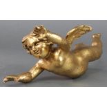 A carved gilt painted figure of a cherub 10" Two fingers are missing and the right palm has been