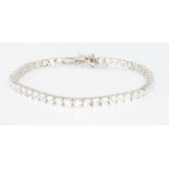 A silver and cubic zirconia line bracelet