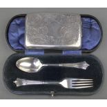 A cased silver fork and spoon Sheffield 1909 together with a silver cigarette case with chased