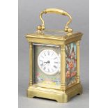A reproduction miniature enamel and gilt metal carriage timepiece, the circular enamelled dial