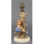 A Hummel table lamp in the form of a girl sitting in the branches of a tree 9" 1 branch has a