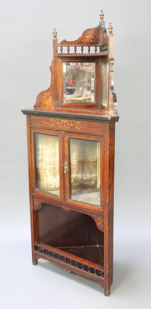 A Victorian inlaid rosewood corner cabinet with pierced raised back fitted a pair of bevelled