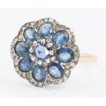 A 15ct yellow gold sapphire and diamond cluster ring size L
