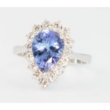 An 18ct white gold pear cut tanzanite and diamond ring, the centre stone approx 1.93ct surrounded by